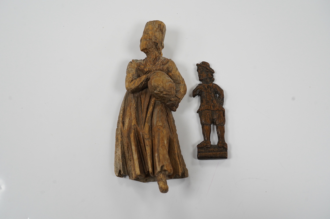 Two 17th century or earlier, European carved oak figures, tallest 20cm high. Condition - fair considering age